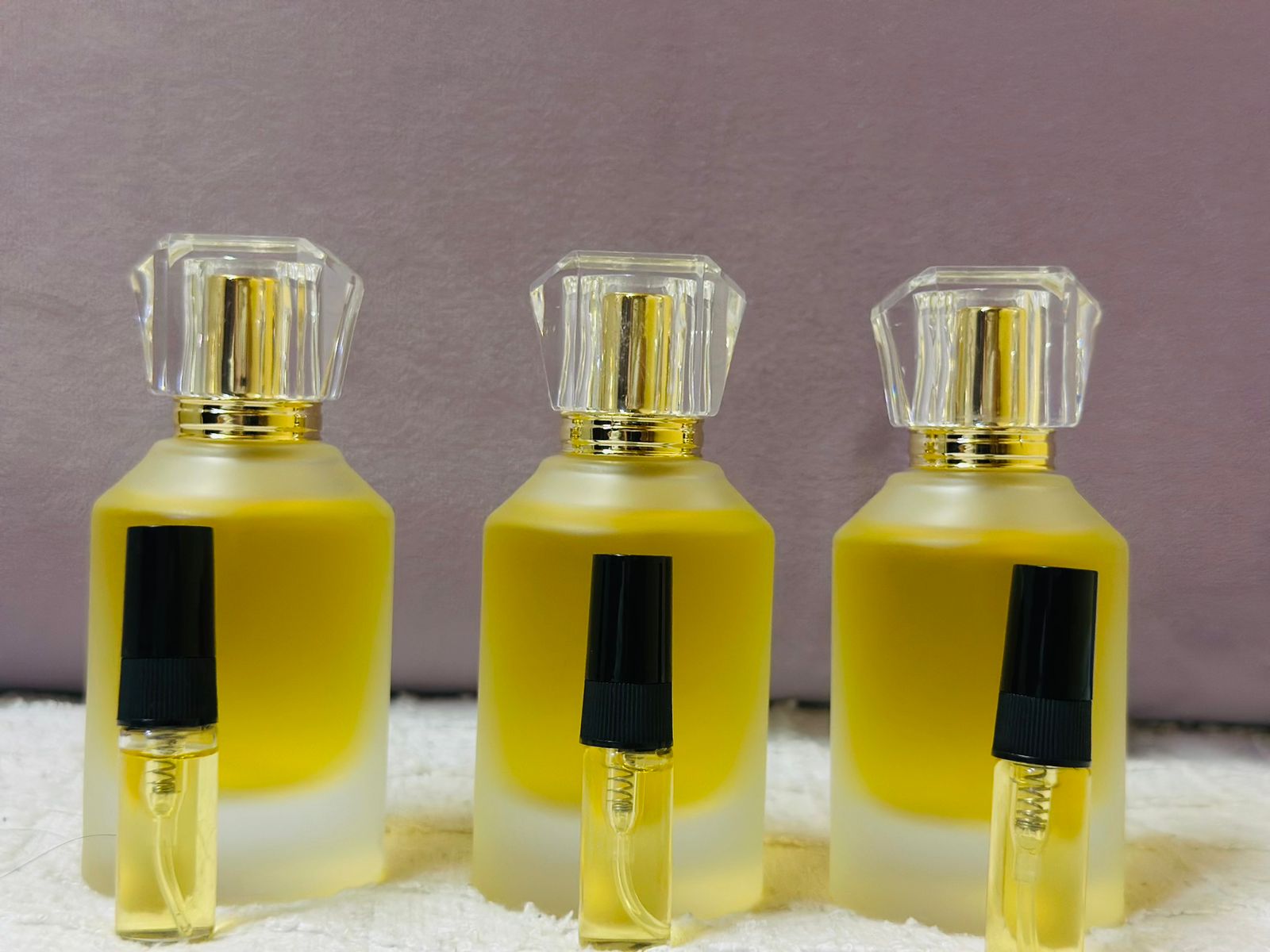Handmade perfume bottles with testers by a student